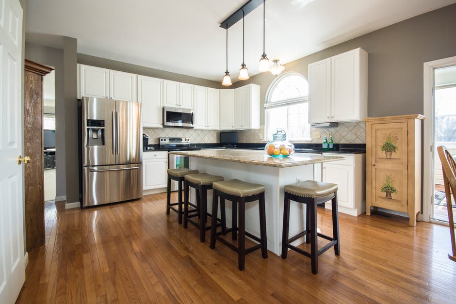 hardwood restoration floor with kitchen furniture